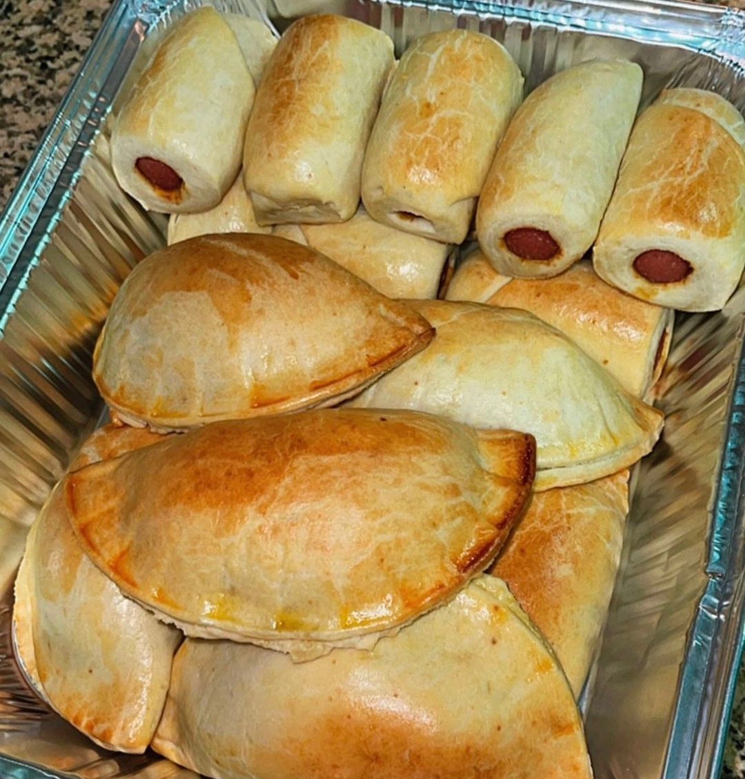 Tray of meat pies and sausage rolls