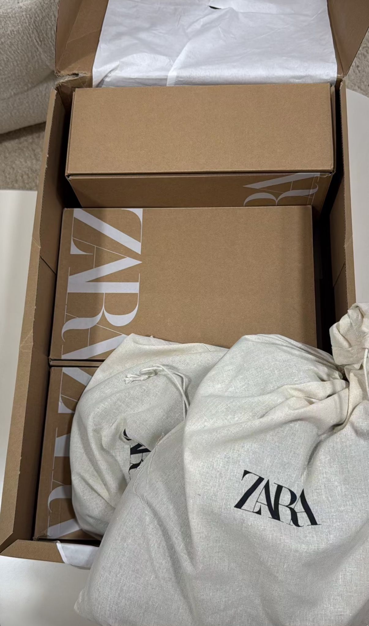 Pink handbag presented in luxury packaging